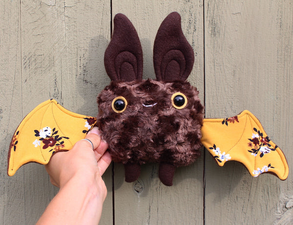 Small Brown Bat with Yellow Floral Wings